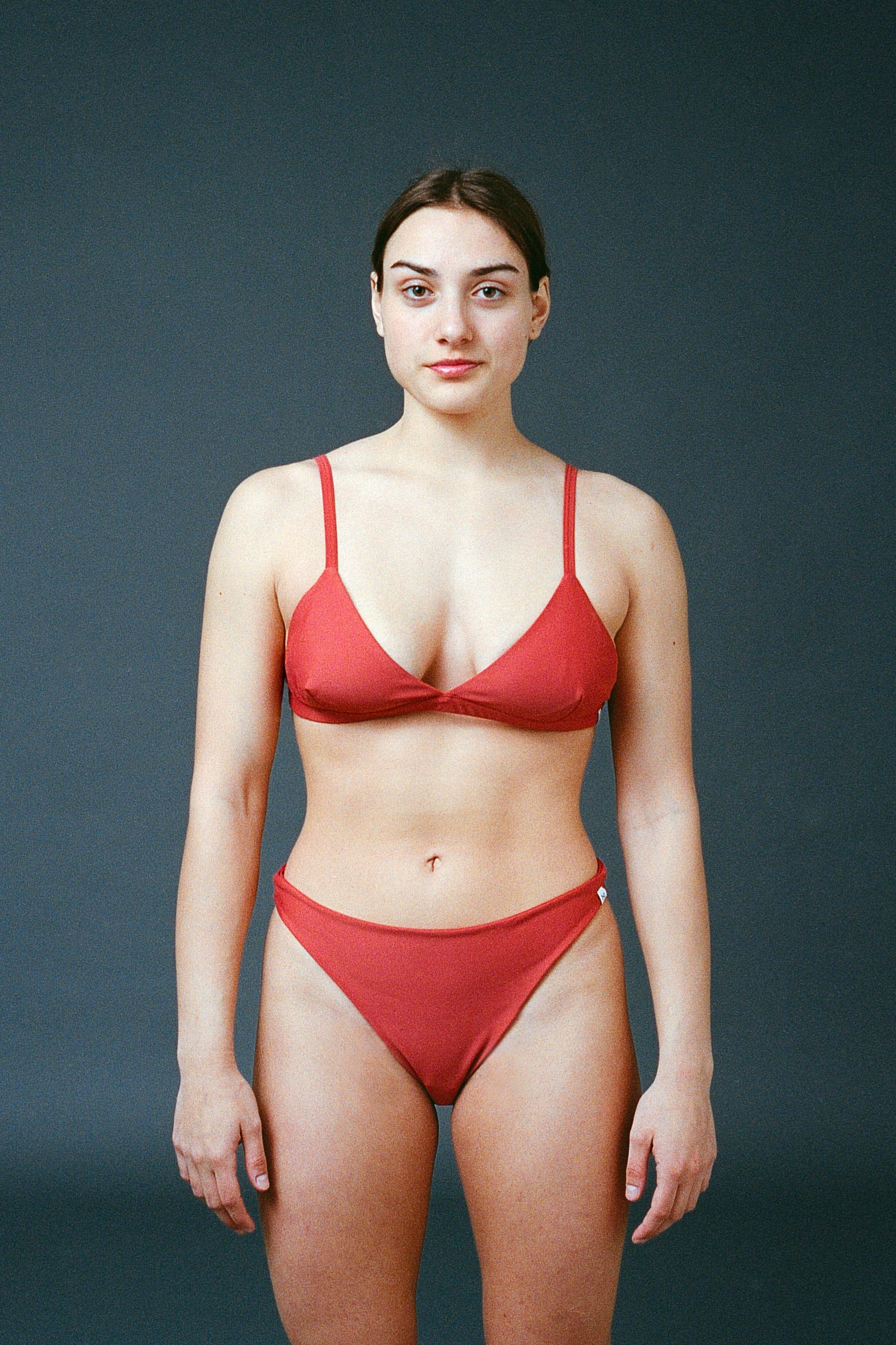 Sustainable bikini made from recycled nylon, orange color, studio shot, made locally in Switzerland