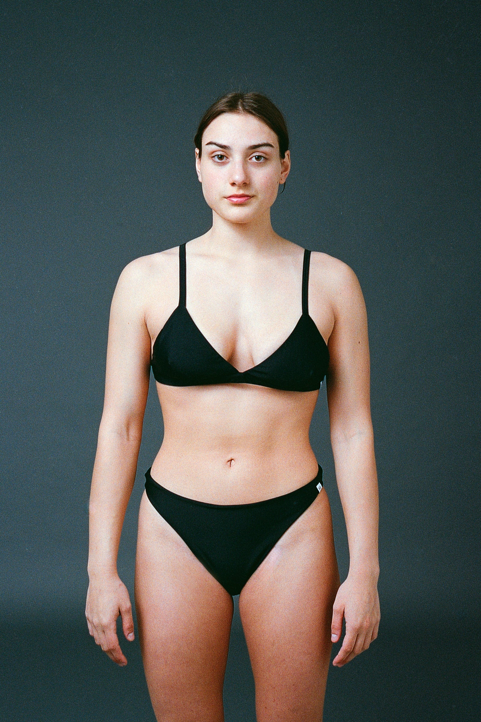 Sustainable bikini made from recycled nylon, color black, studio image, made locally in Switzerland