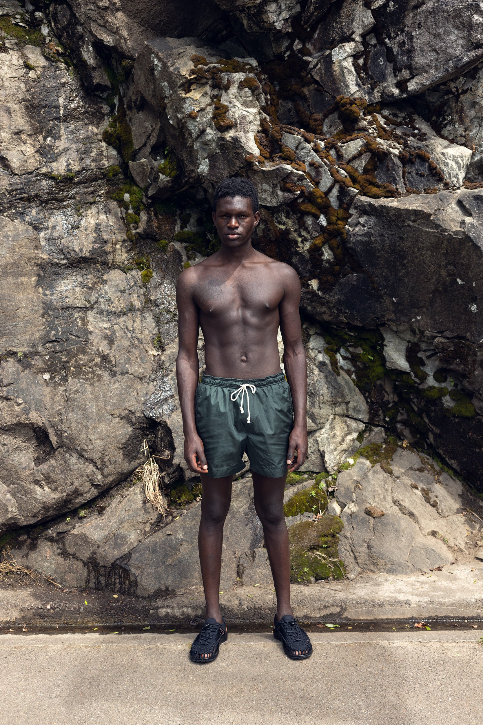 Sustainable swimming trunks made from recycled nylon, olive color, outdoor, made locally in Switzerland