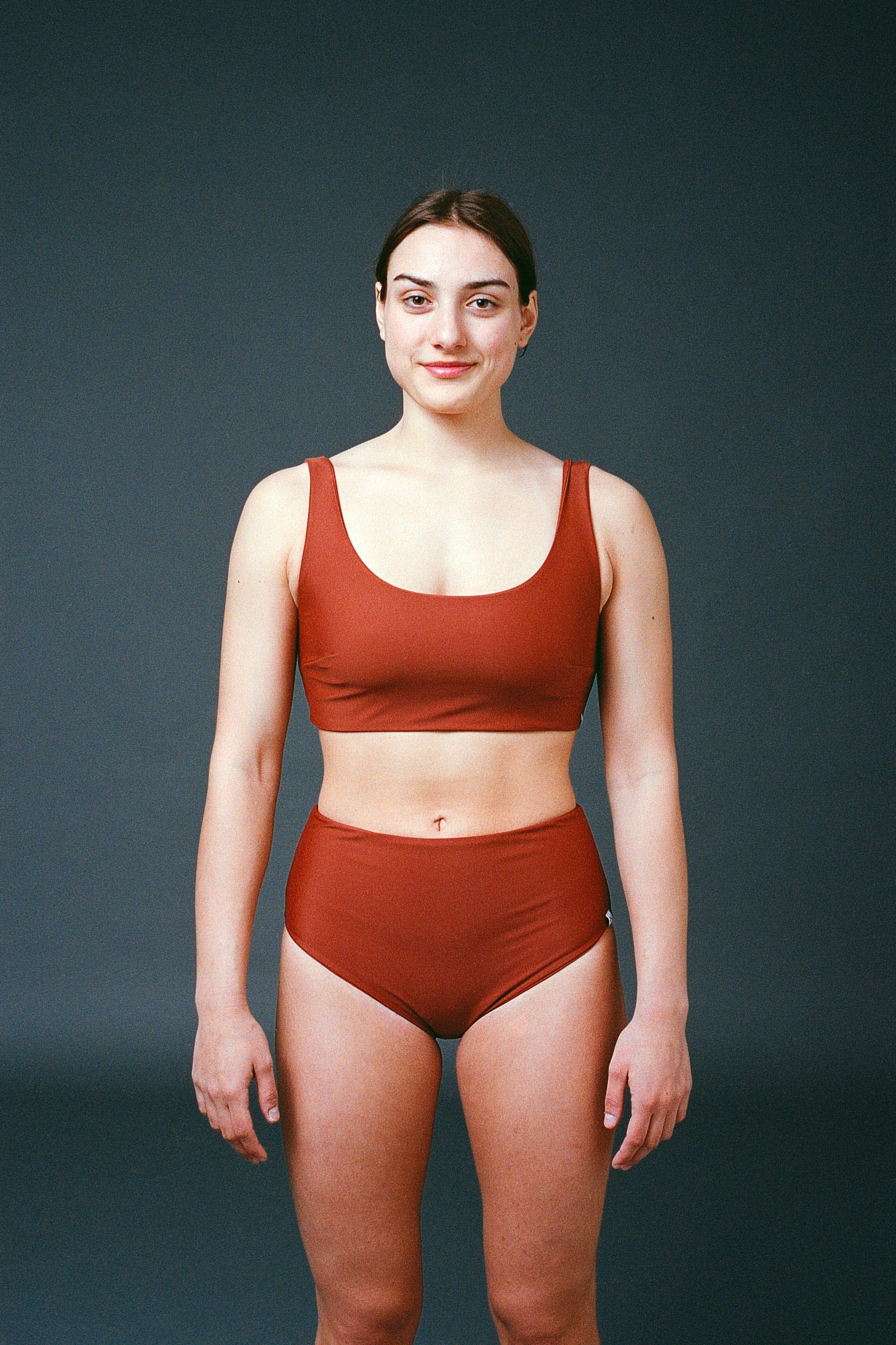 Sustainable bikini made from recycled nylon, terracotta color, studio, made locally in Switzerland